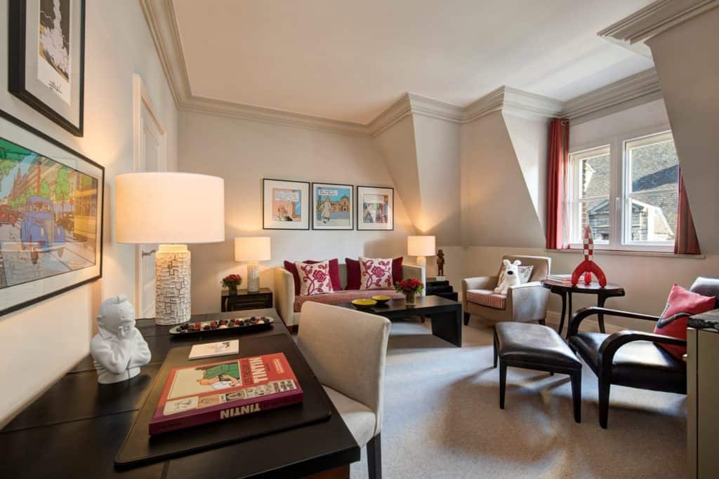 Luxurious hotel suite with red accents