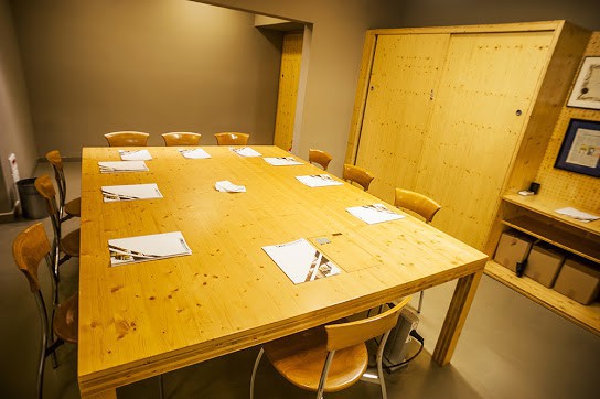 Boardroom with glass walls and wood design