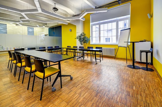 Yellow meeting space with glass walls