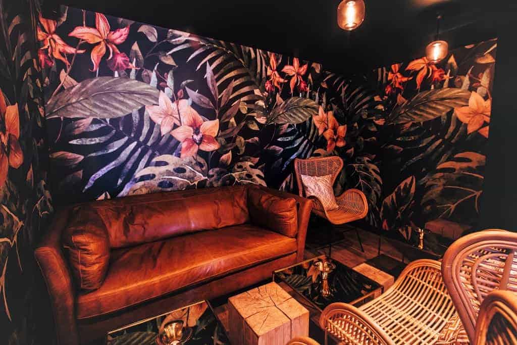Unique jungle venue for corporate events with quirky wallpaper and sleek decoration.