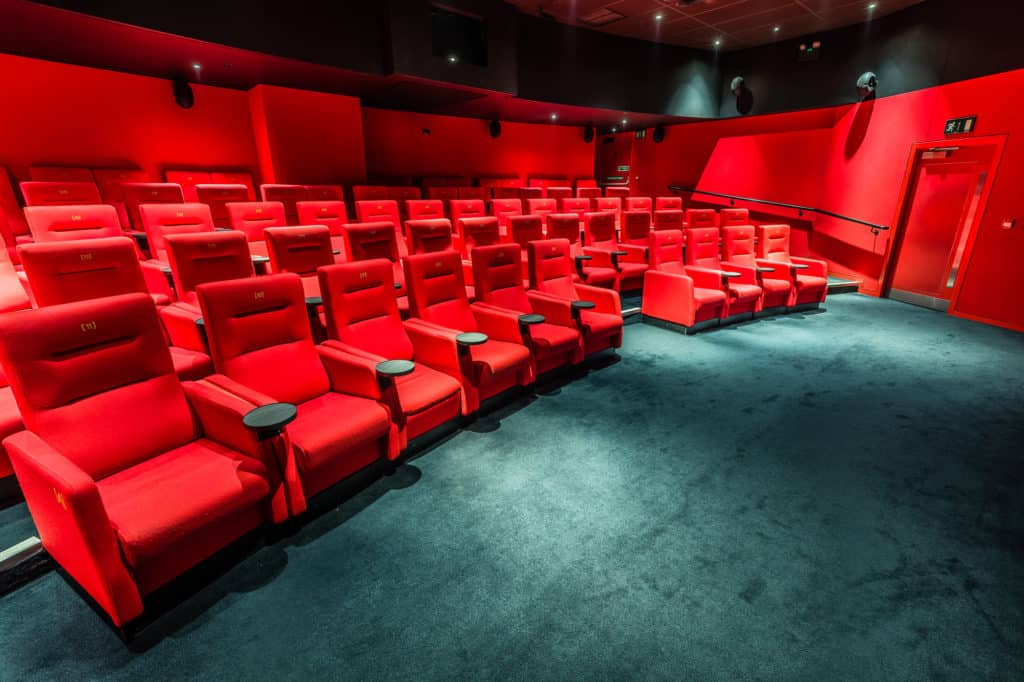 Quirky screening room painted in red with top-of-the-range technology and 69 seats.