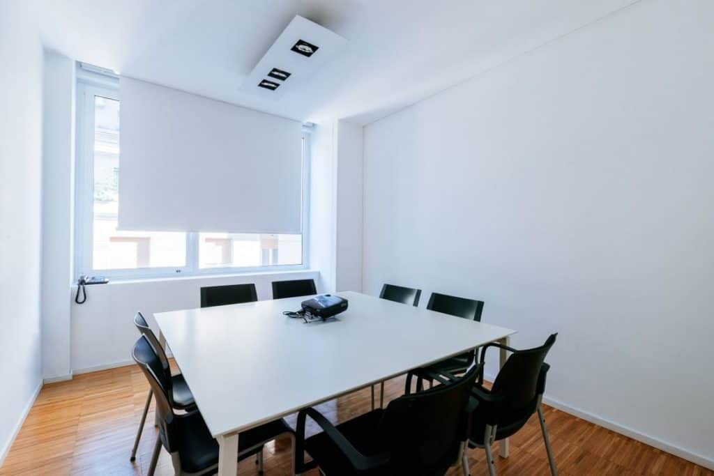 White innovative room for meetings boasting white walls and plenty of natural light.