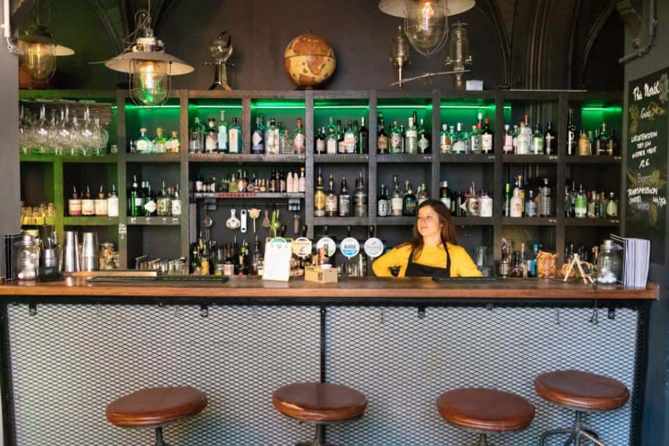 Bar tender behind a hip bar in Brussels