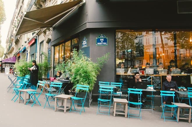 Facade and terrace of a cafe shop in Paris