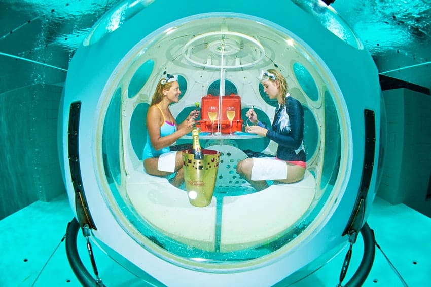 Dinner on the bottom of an indoor diving pool