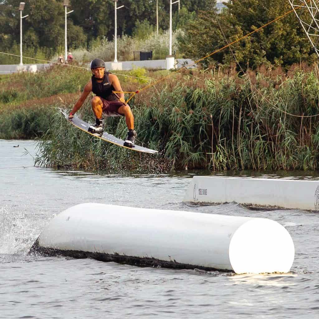 Men doing water skiing tricks