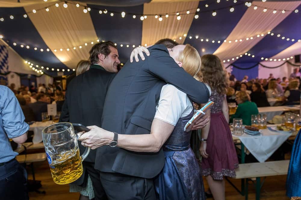 Event photograph of men and woman hugging on Oktoberfest in Munich