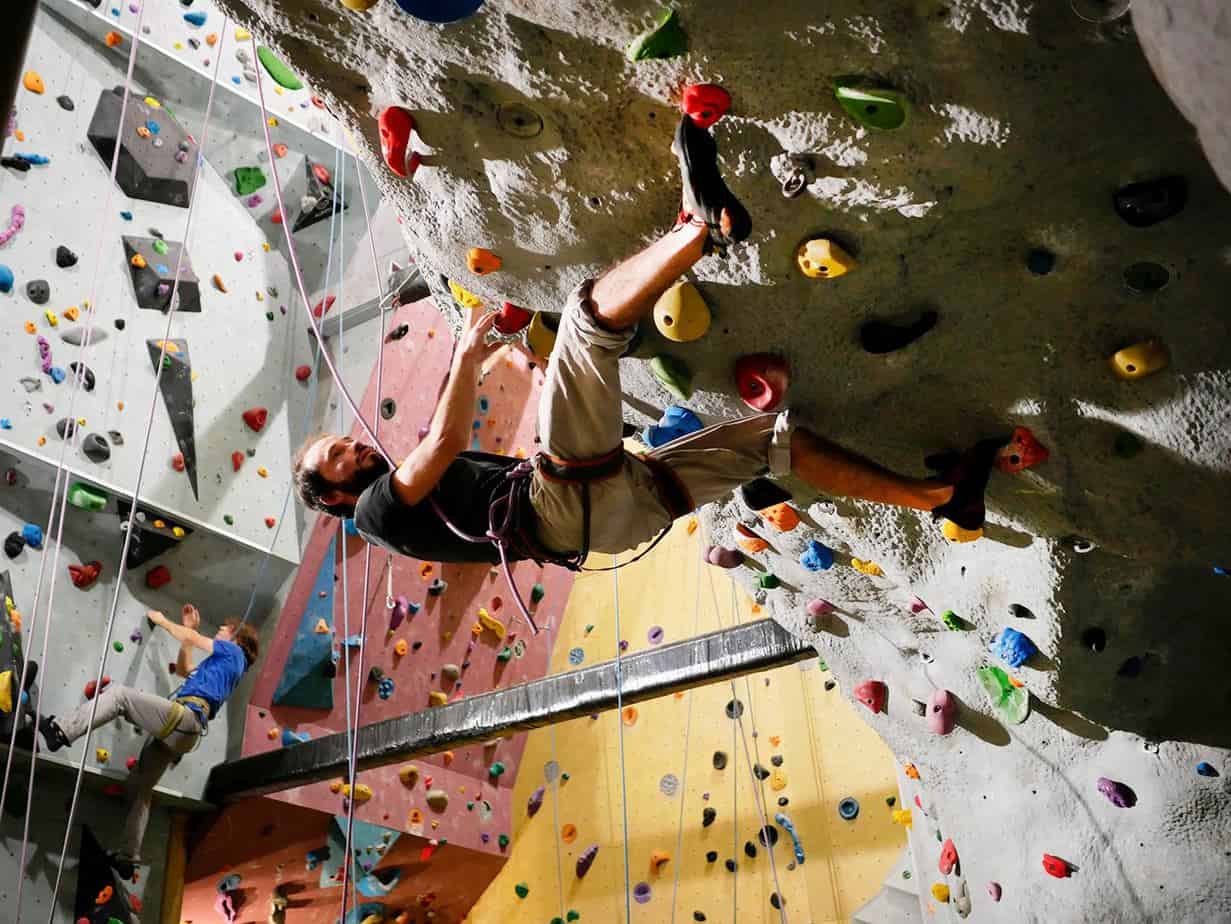 Man climbing in an indoor climbing hall