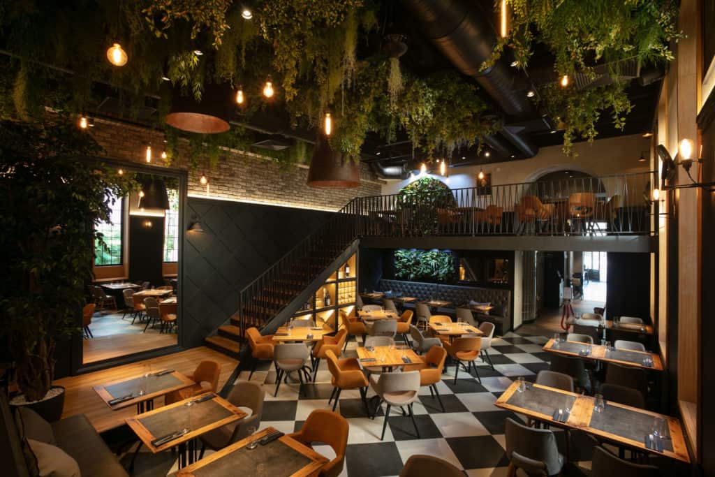 Quirky restaurant with ceiling of plants