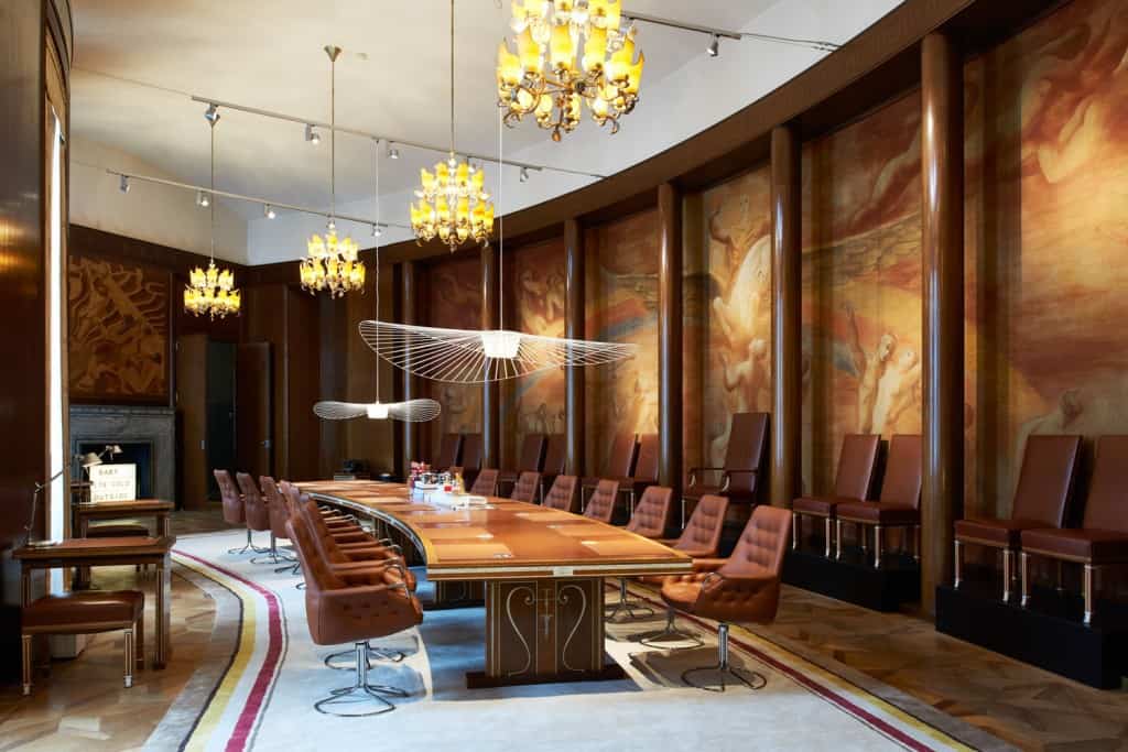 Majestic and classic conference room with brown leather furniture and frescos