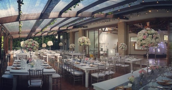 Delightful event space surrounded by lush greenery